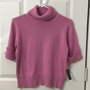 Size M short cuffed sleeve turtle neck sweater. Great under a jacket.